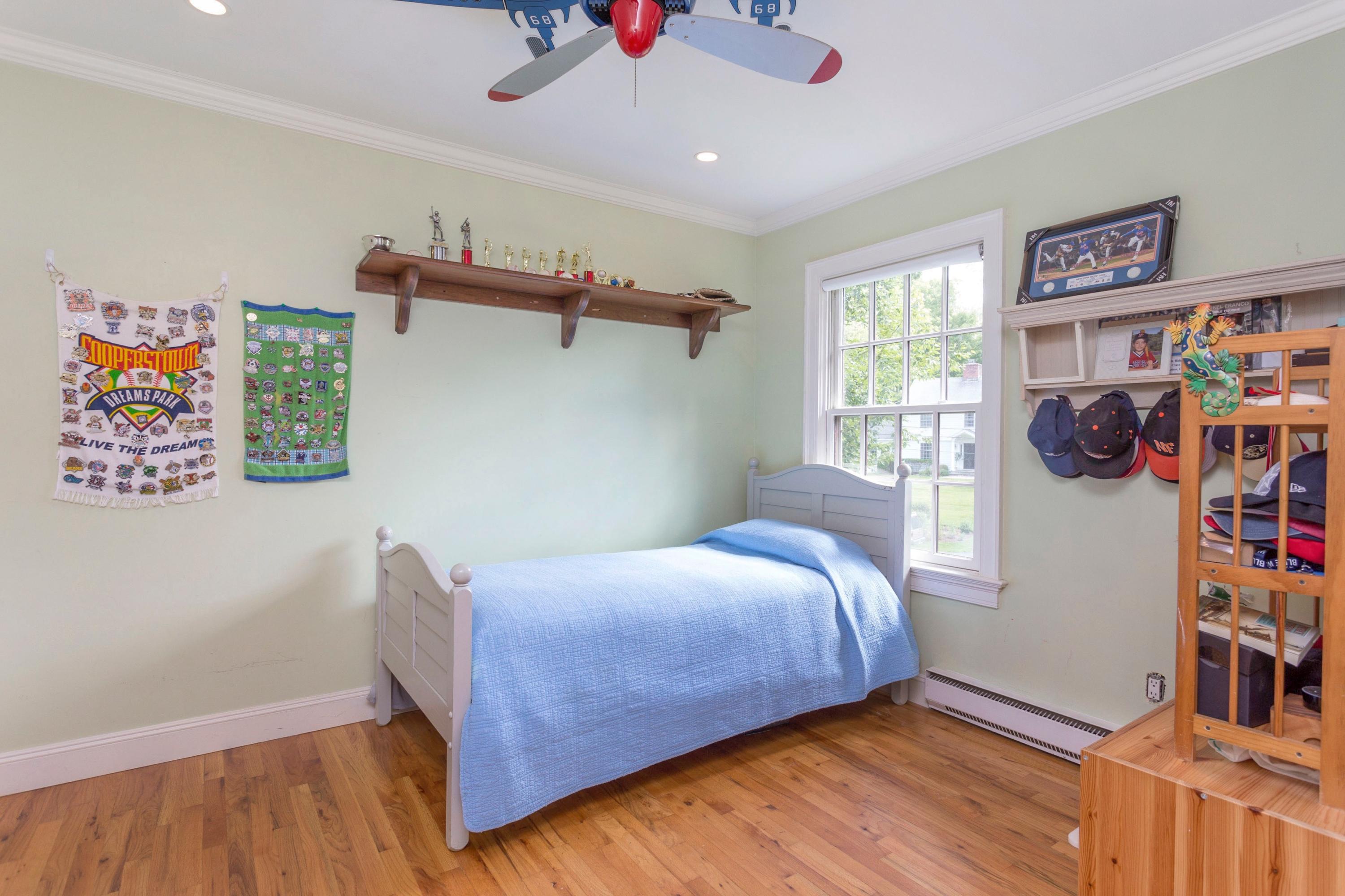 34 Country Club Road Darien, CT 06820 - Photo 15 of 17 a bedroom with a bed and a window