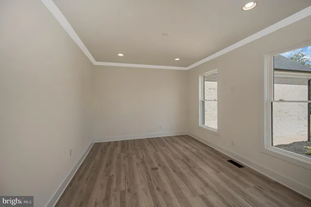 a view of room with window and hardwood floor