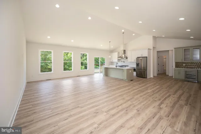 a view of kitchen with cabinets and wooden floor