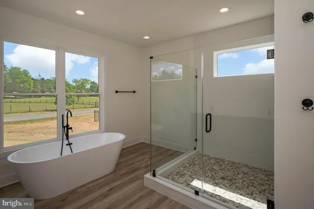 a bathroom with a sink mirror toilet and bathtub