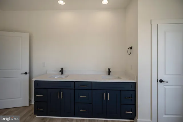 a bathroom with bathtub and window