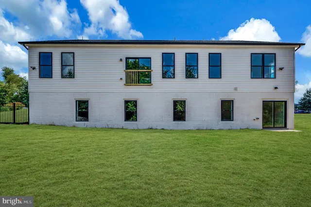 a house that has a big yard in front of it