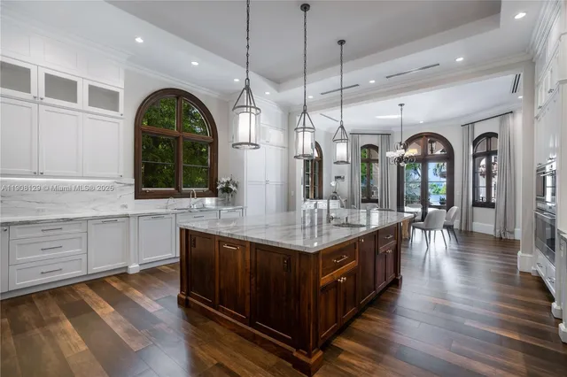 a living room with furniture ceiling fan and a rug