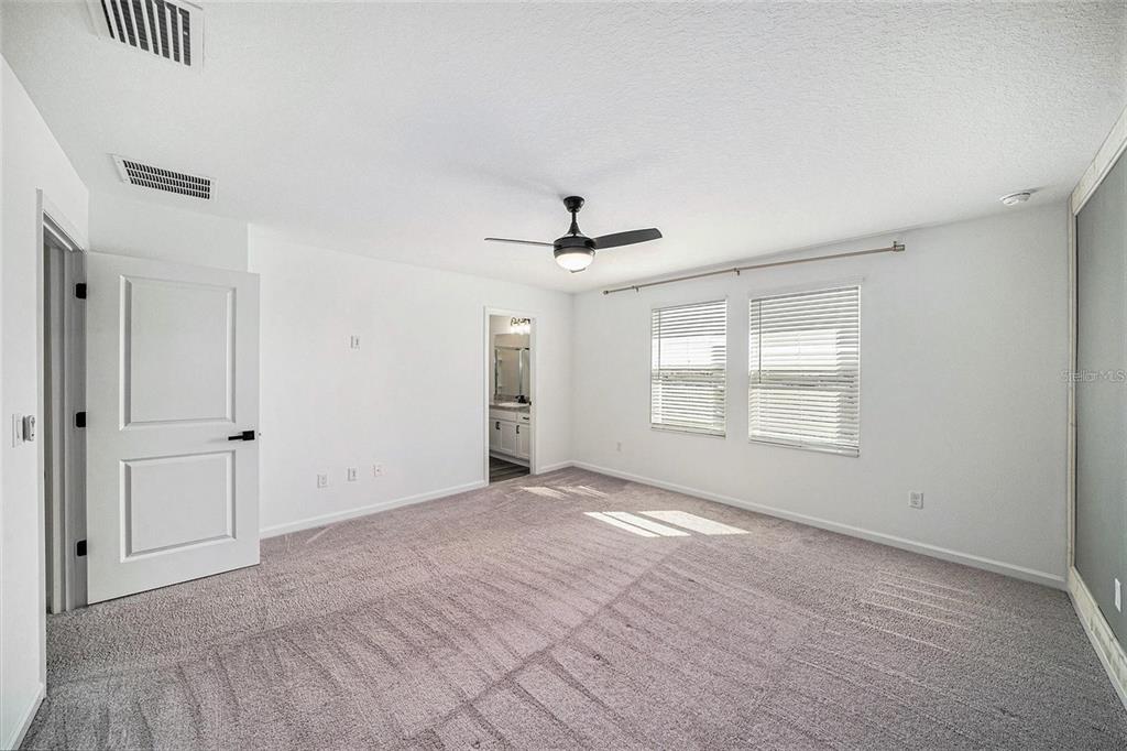 35542 Buttonweed Trail Zephyrhills, FL 33541 - Photo 17 of 30 a view of an empty room with a window