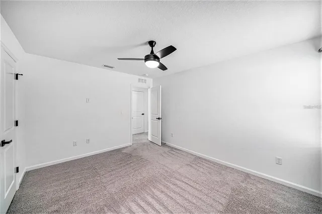 a view of room with ceiling fan