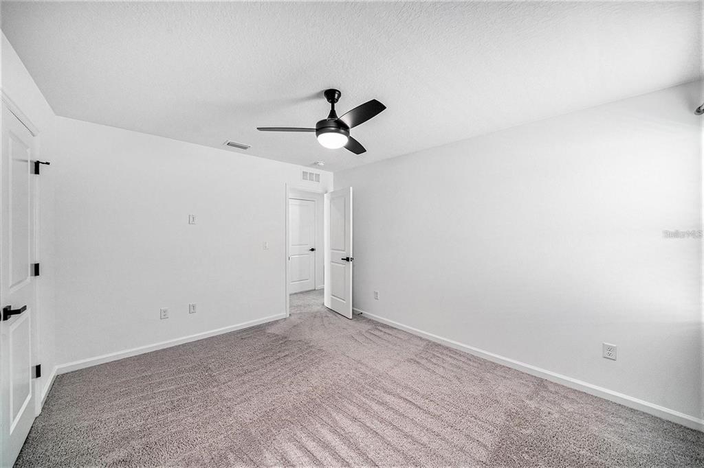 35542 Buttonweed Trail Zephyrhills, FL 33541 - Photo 20 of 30 a view of room with ceiling fan