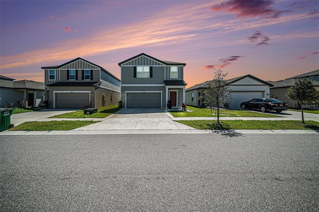 35542 Buttonweed Trail Zephyrhills, FL 33541 - Photo 2 of 30 a front view of a house with entertaining space and yard