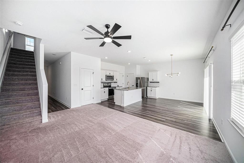 35542 Buttonweed Trail Zephyrhills, FL 33541 - Photo 5 of 30 a view of empty room with wooden floor and window