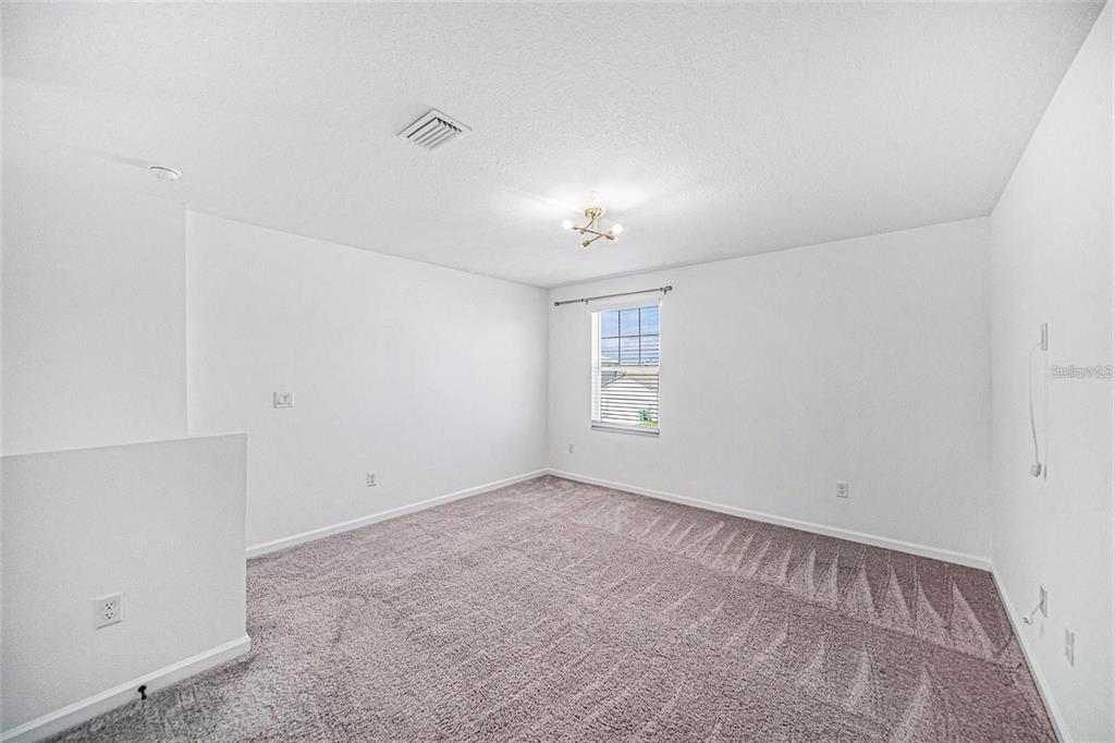 35542 Buttonweed Trail Zephyrhills, FL 33541 - Photo 8 of 30 an empty room with windows