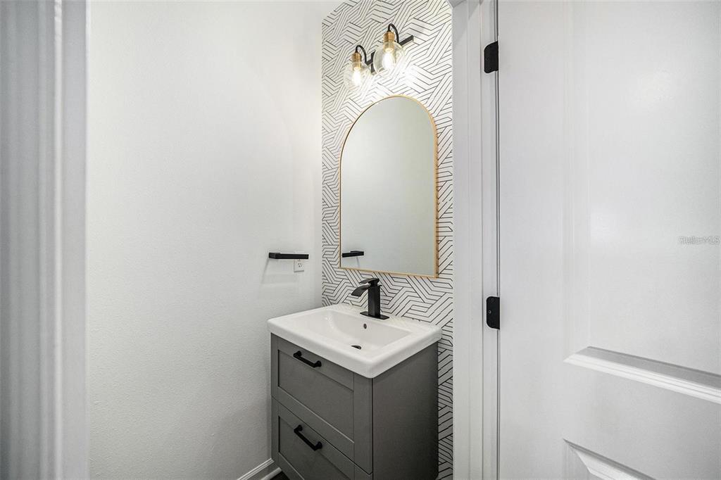 35542 Buttonweed Trail Zephyrhills, FL 33541 - Photo 10 of 30 a bathroom with a sink and mirror