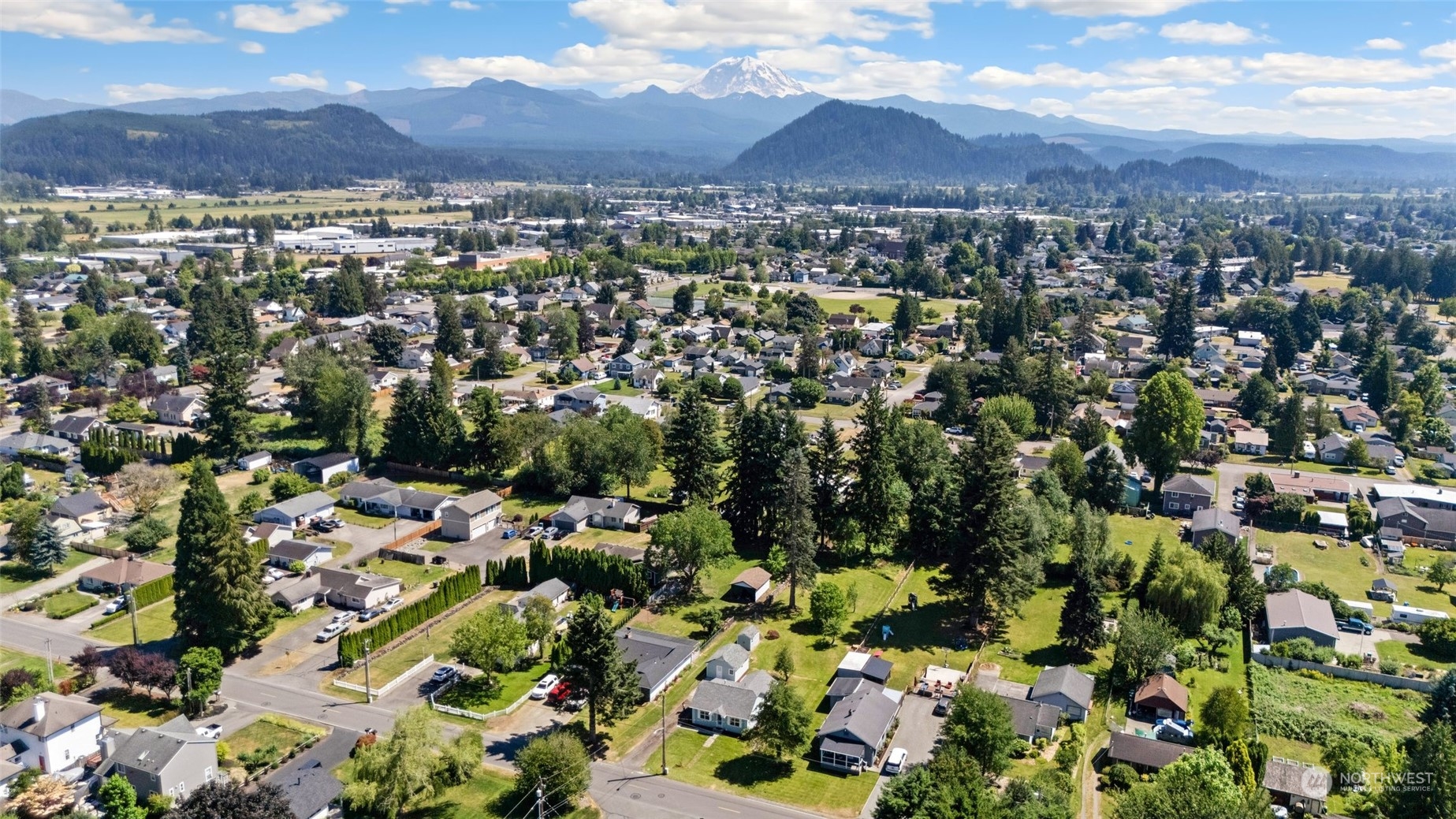 1918 McHugh Avenue Enumclaw, WA 98022 - Photo 1 of 16 an aerial view of residential houses with outdoor space
