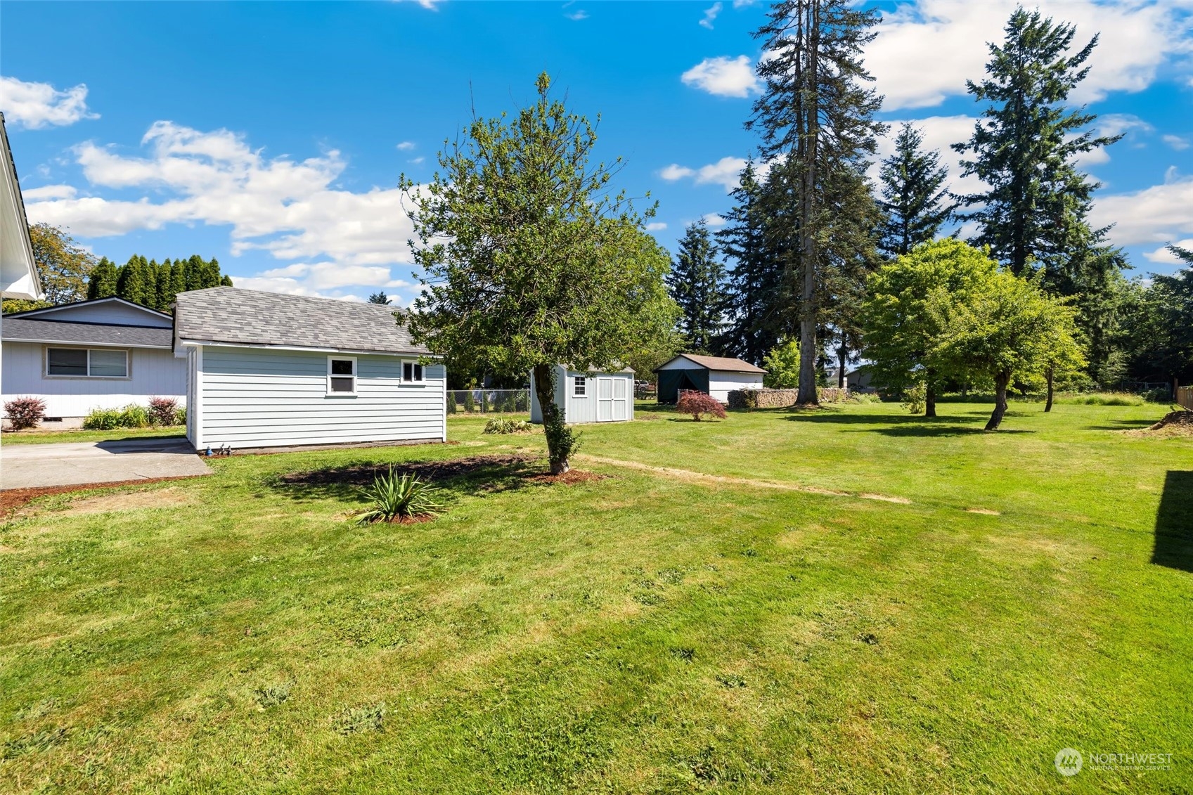 1918 McHugh Avenue Enumclaw, WA 98022 - Photo 14 of 16 a view of a house with a yard and a tree