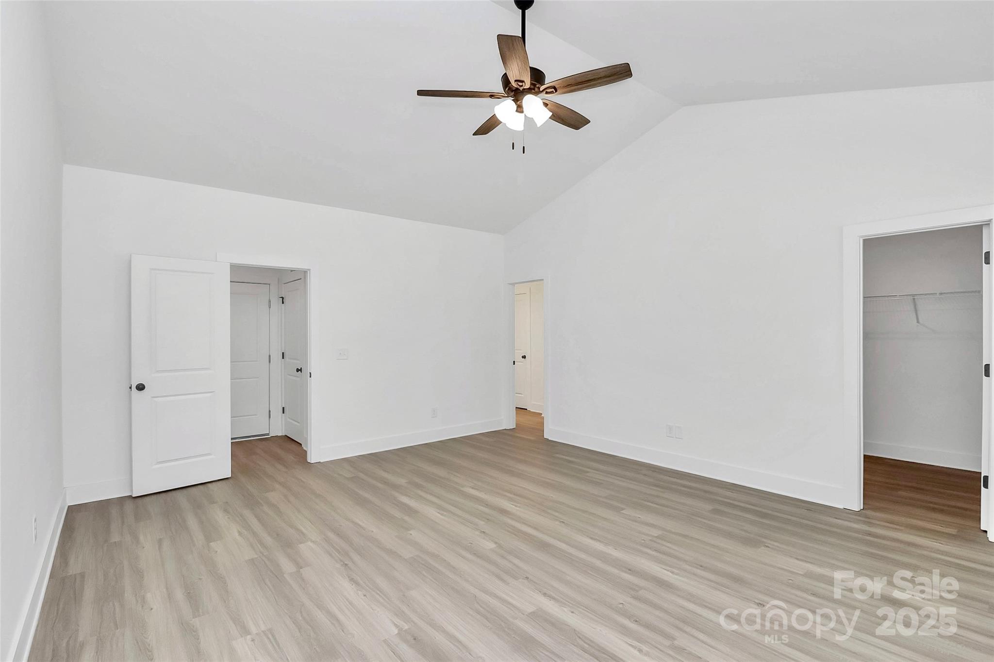 6122 Lowder Road Salisbury, NC 28147 - Photo 16 of 31 a view of a room with wooden floor and a ceiling fan