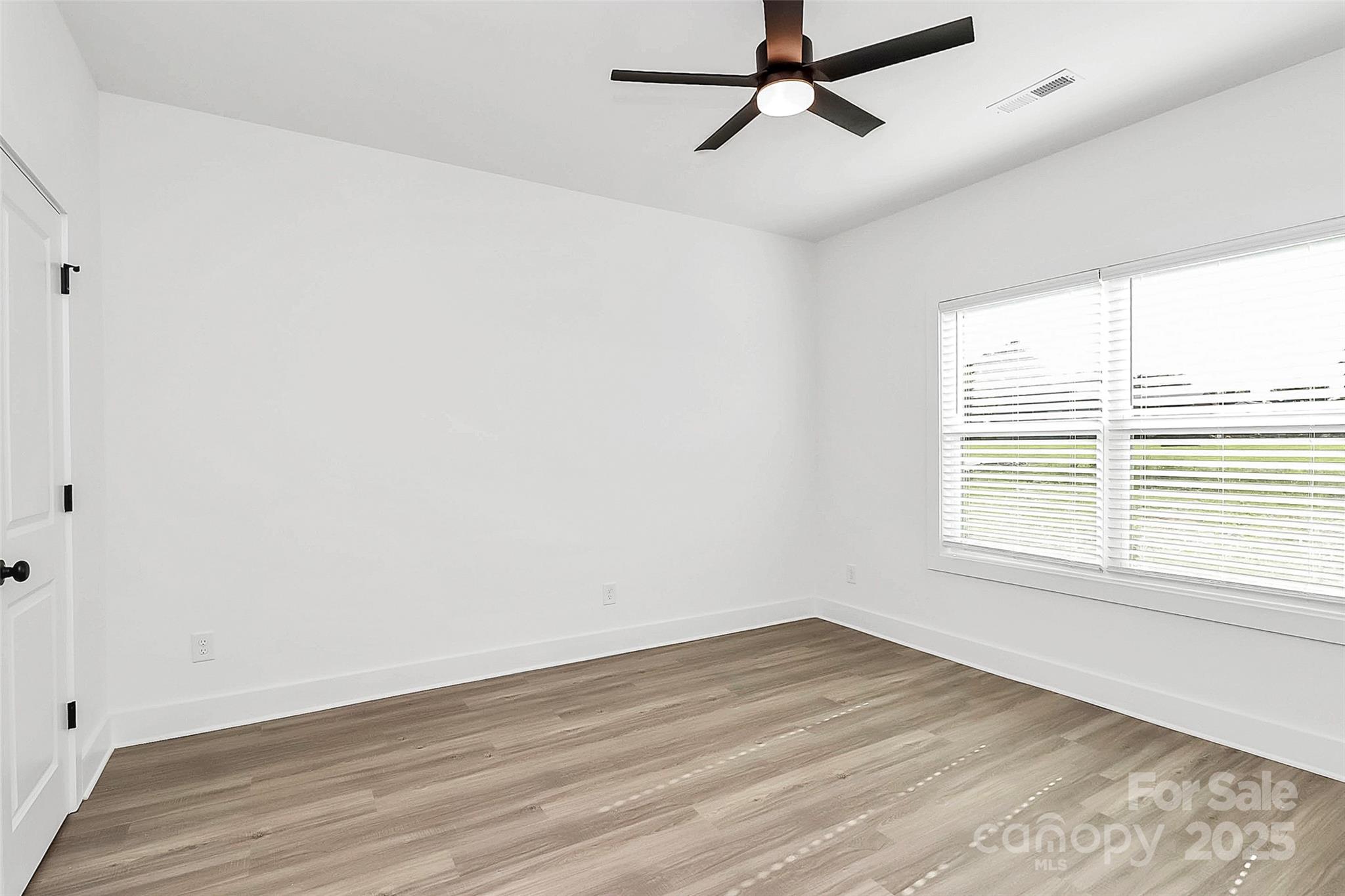 6122 Lowder Road Salisbury, NC 28147 - Photo 20 of 31 a view of a room with wooden floor and windows