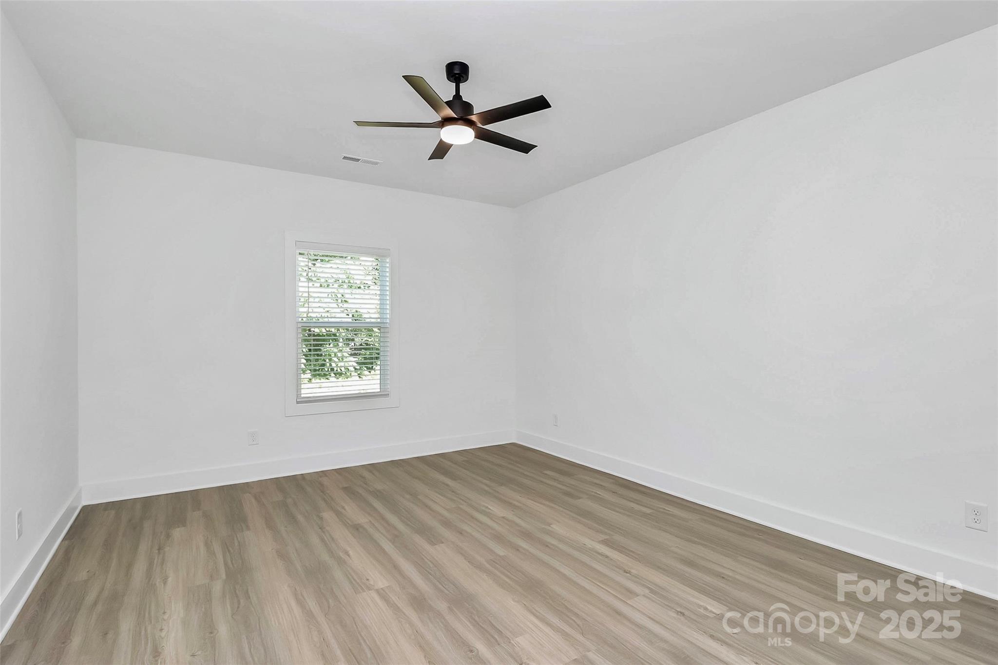 6122 Lowder Road Salisbury, NC 28147 - Photo 23 of 31 wooden floor in an empty room with a window