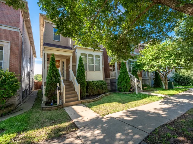 a front view of a house with a yard