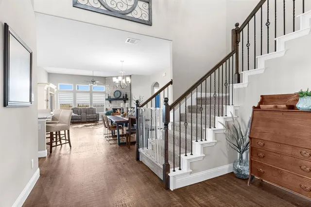 a view of entryway wih livingroom and stairs