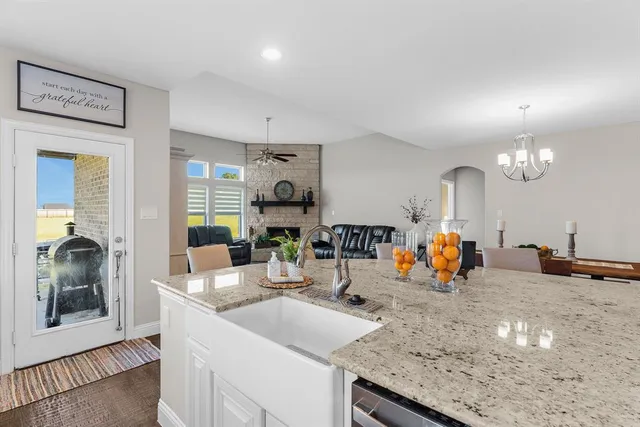 a living room with furniture flat screen tv and a fireplace