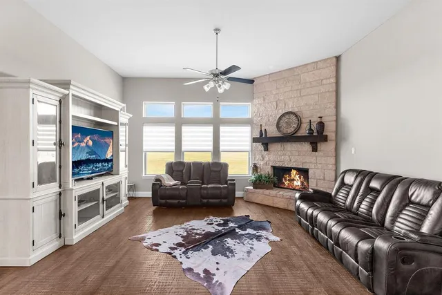a living room with furniture and a fireplace