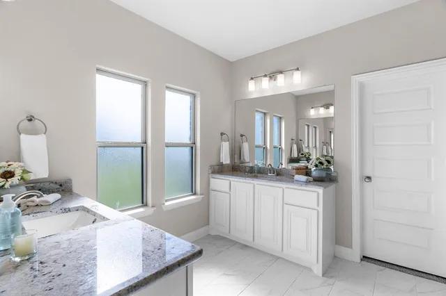 a bathroom with a bathtub and shower