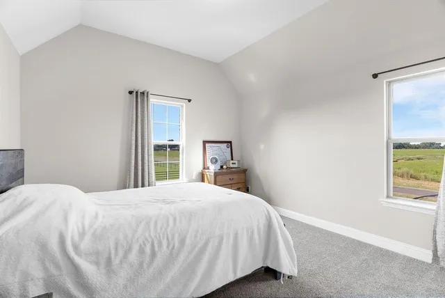 a dining room with furniture and windows