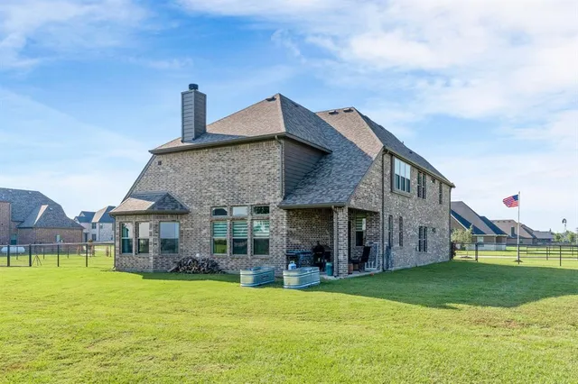a kitchen with a refrigerator and a stove