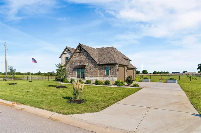 a house with garden in front of it