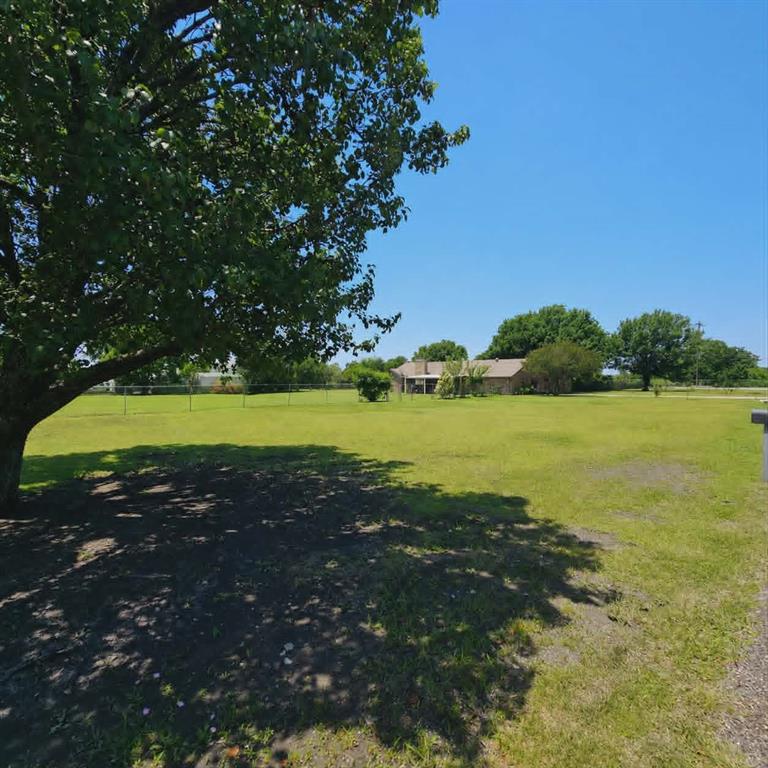 14752 Ranch Road Forney, TX 75126 - Photo 39 of 40 Expansive green lawn with mature trees and partial fencing
