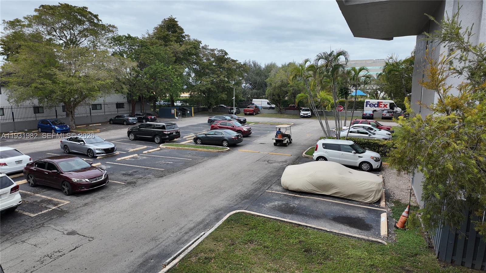11120 Southwest 196th Street, Unit 201 Cutler Bay, FL 33157 - Photo 17 of 18 a cars parked in front of a house