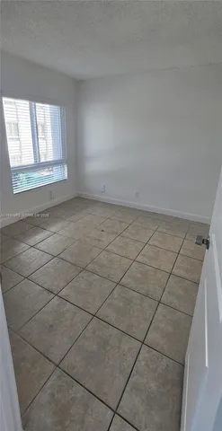 a bathroom with a glass door shower