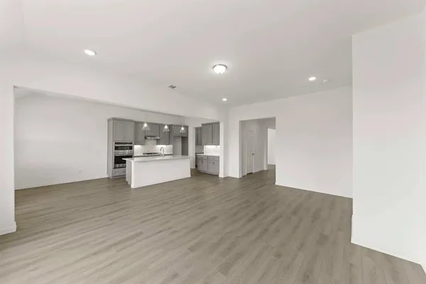 a view of kitchen and wooden floor