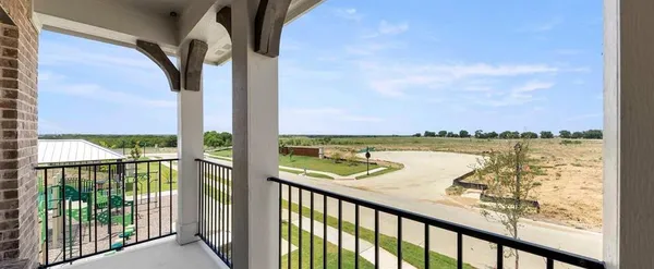 a view of a balcony with an ocean view