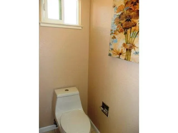 a bathroom with a toilet and a sink