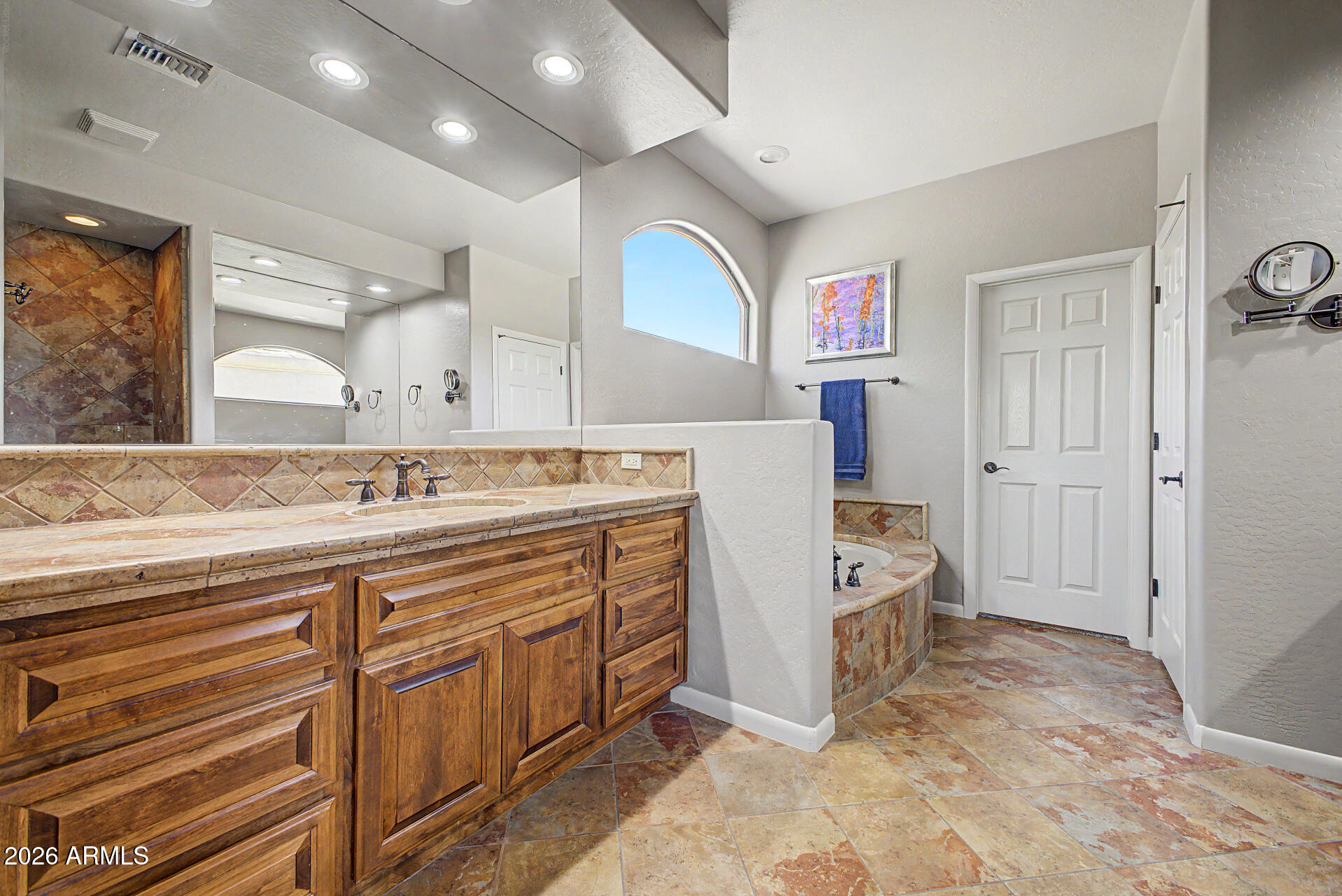 27909 North Quail Spring Road Rio Verde, AZ 85263 - Photo 19 of 52 a spacious bathroom with a sink a mirror and a bathtub