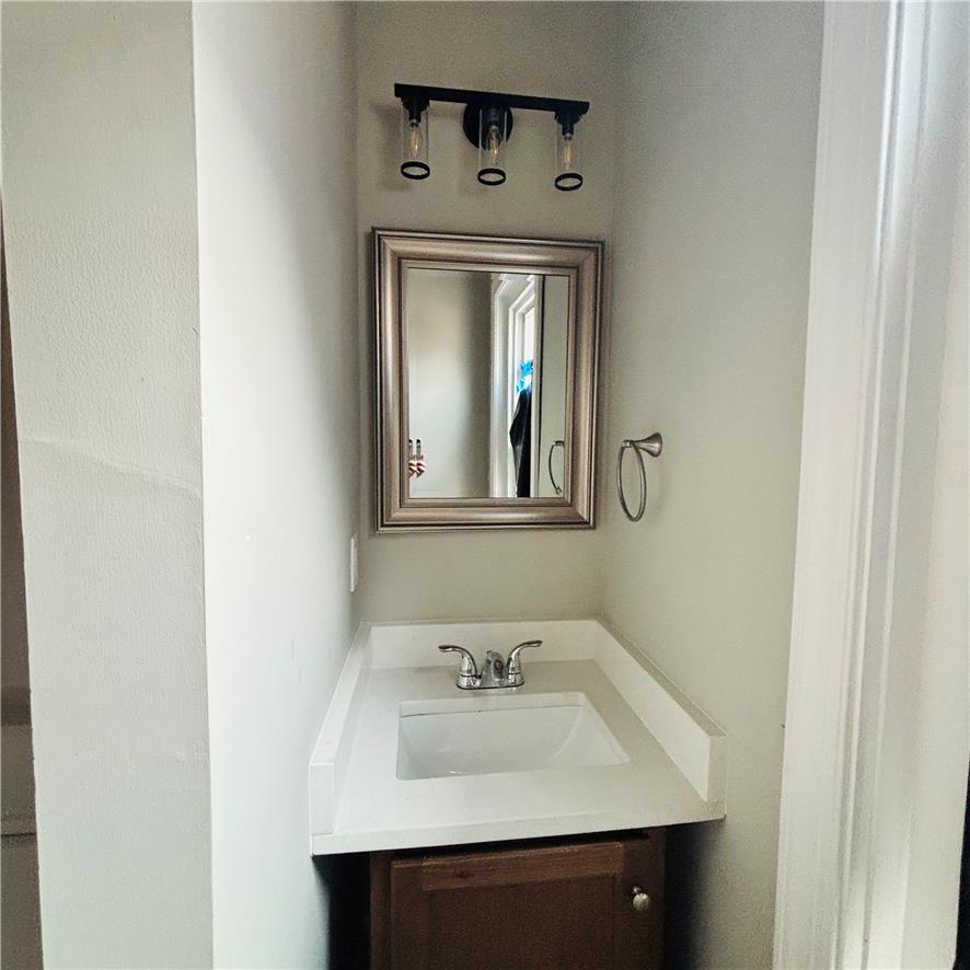 718 Linden Street Bethlehem, PA 18018 - Photo 19 of 19 A well-appointed powder room features a classic vanity and stylish overhead lighting.