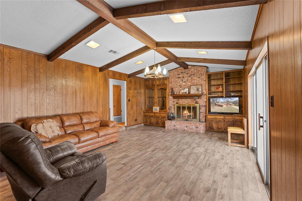1447 Red Gate Road Mart, TX 76664 - Photo 33 of 38 a living room with furniture and wooden floor