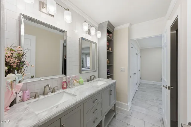 a bathroom with a granite countertop sink mirror and vanity