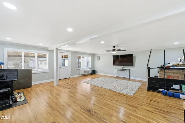 a swimming pool with outdoor seating and yard