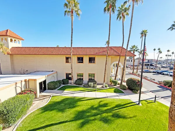a house view with a sitting space and garden