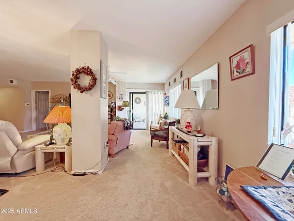 a room that has a bed and a chair in it