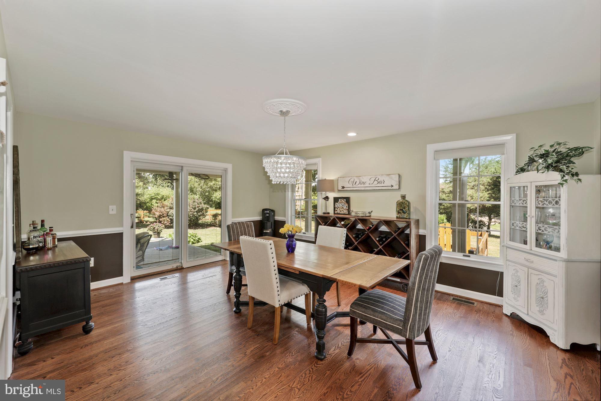 8100 Pinehurst Harbour Way Pasadena, MD 21122 - Photo 43 of 70 Dining Room with sliding glass doors to porch