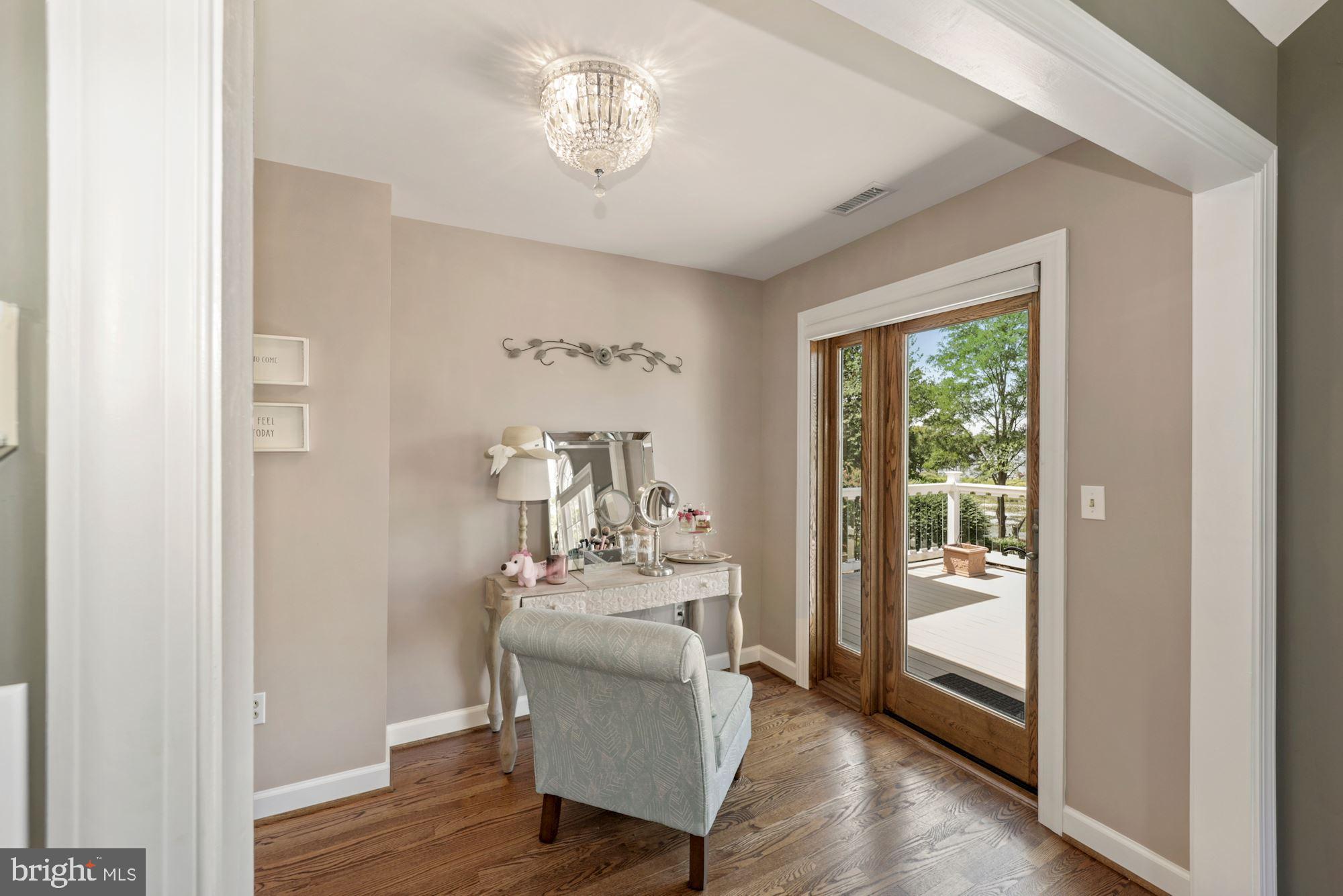 8100 Pinehurst Harbour Way Pasadena, MD 21122 - Photo 52 of 70 Sitting area in master bedroom with door to deck