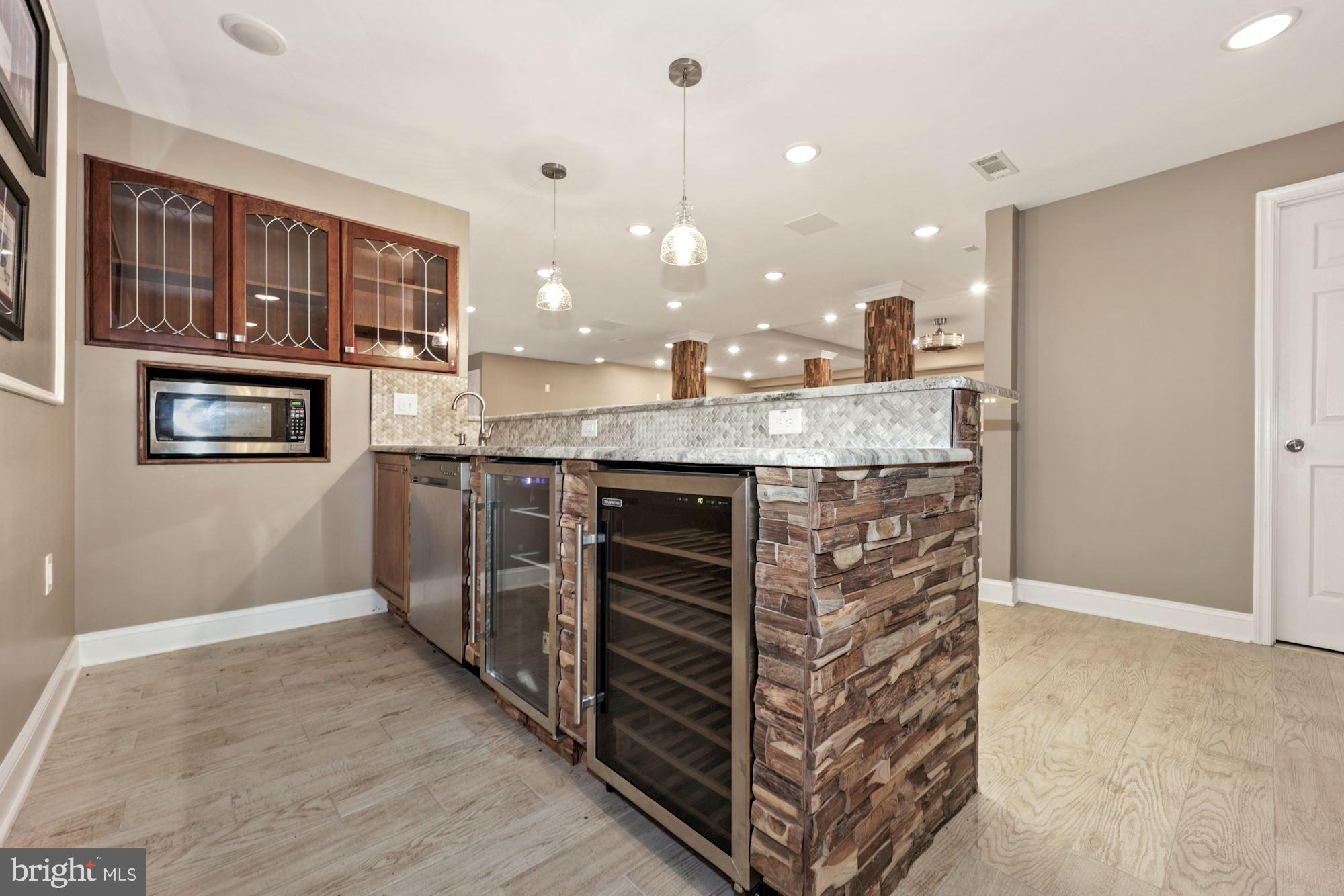 8100 Pinehurst Harbour Way Pasadena, MD 21122 - Photo 66 of 70 Wet Bar and Two Wine Coolers in Bar Area