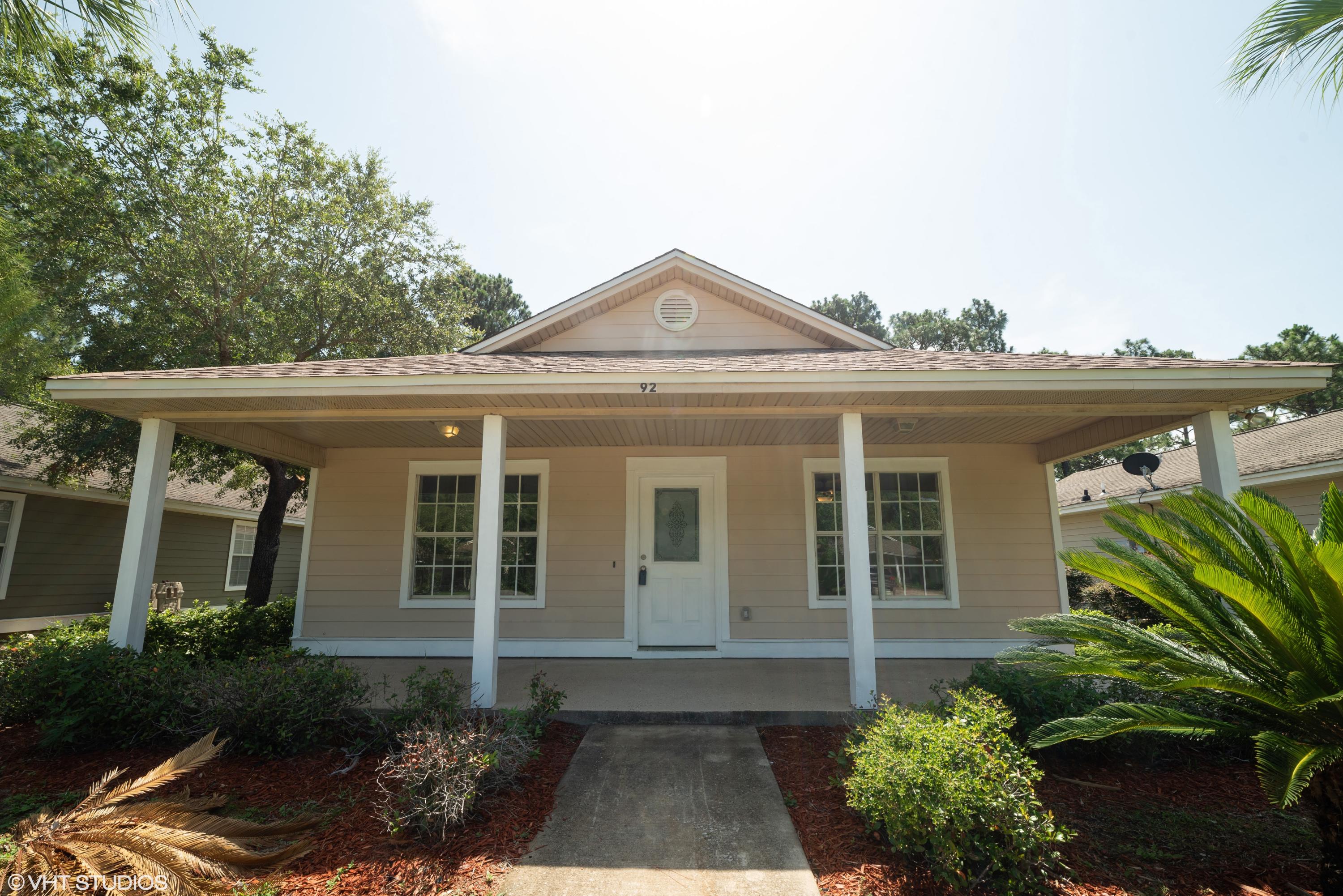 92 Central 7th Street Santa Rosa Beach, FL 32459 - Photo 1 of 25 a front view of a house with garden