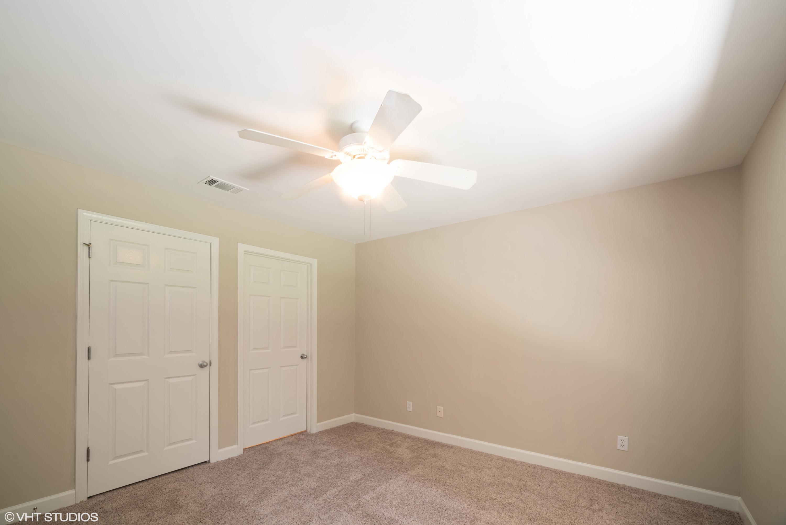 92 Central 7th Street Santa Rosa Beach, FL 32459 - Photo 18 of 25 an empty room with a ceiling fan and a window