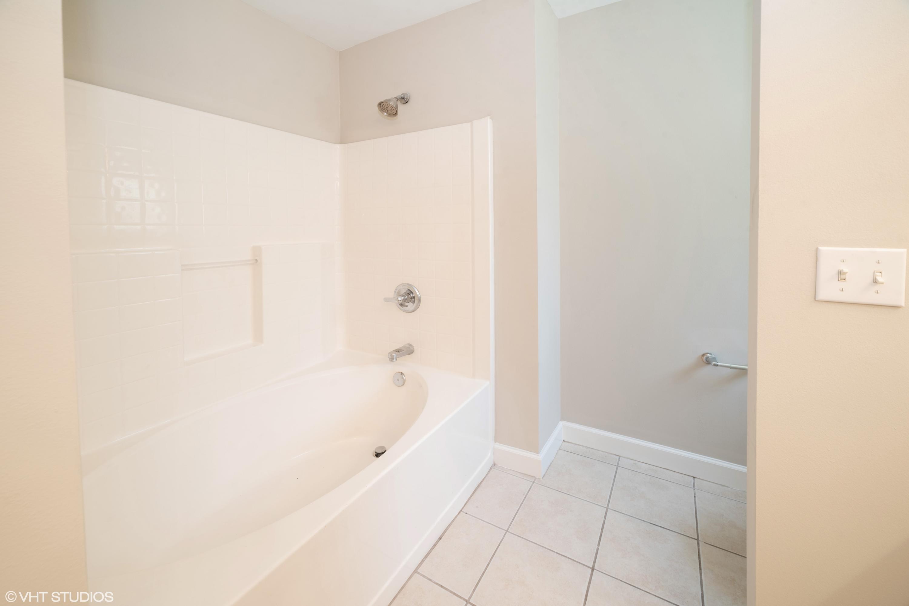 92 Central 7th Street Santa Rosa Beach, FL 32459 - Photo 21 of 25 a bathroom with a bathtub and a shower