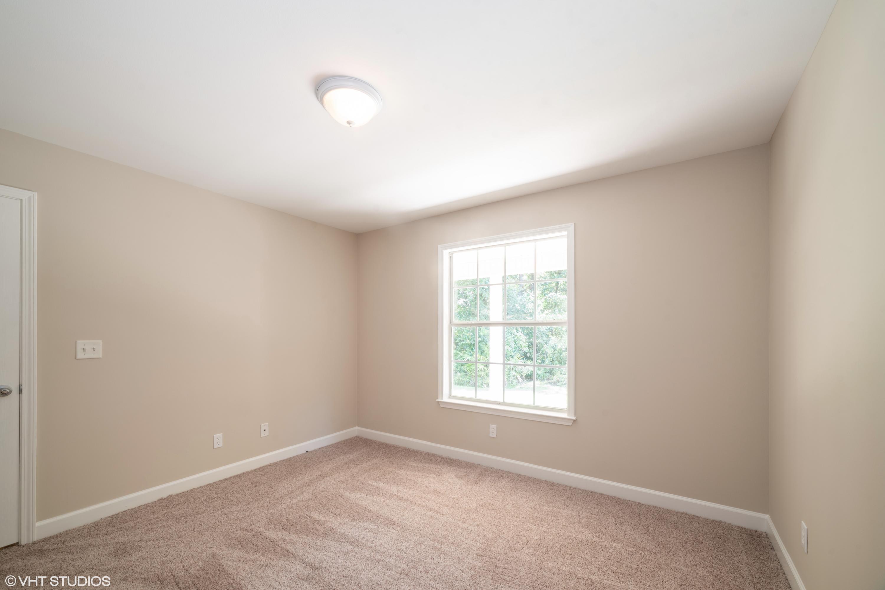 92 Central 7th Street Santa Rosa Beach, FL 32459 - Photo 23 of 25 an empty room with a window