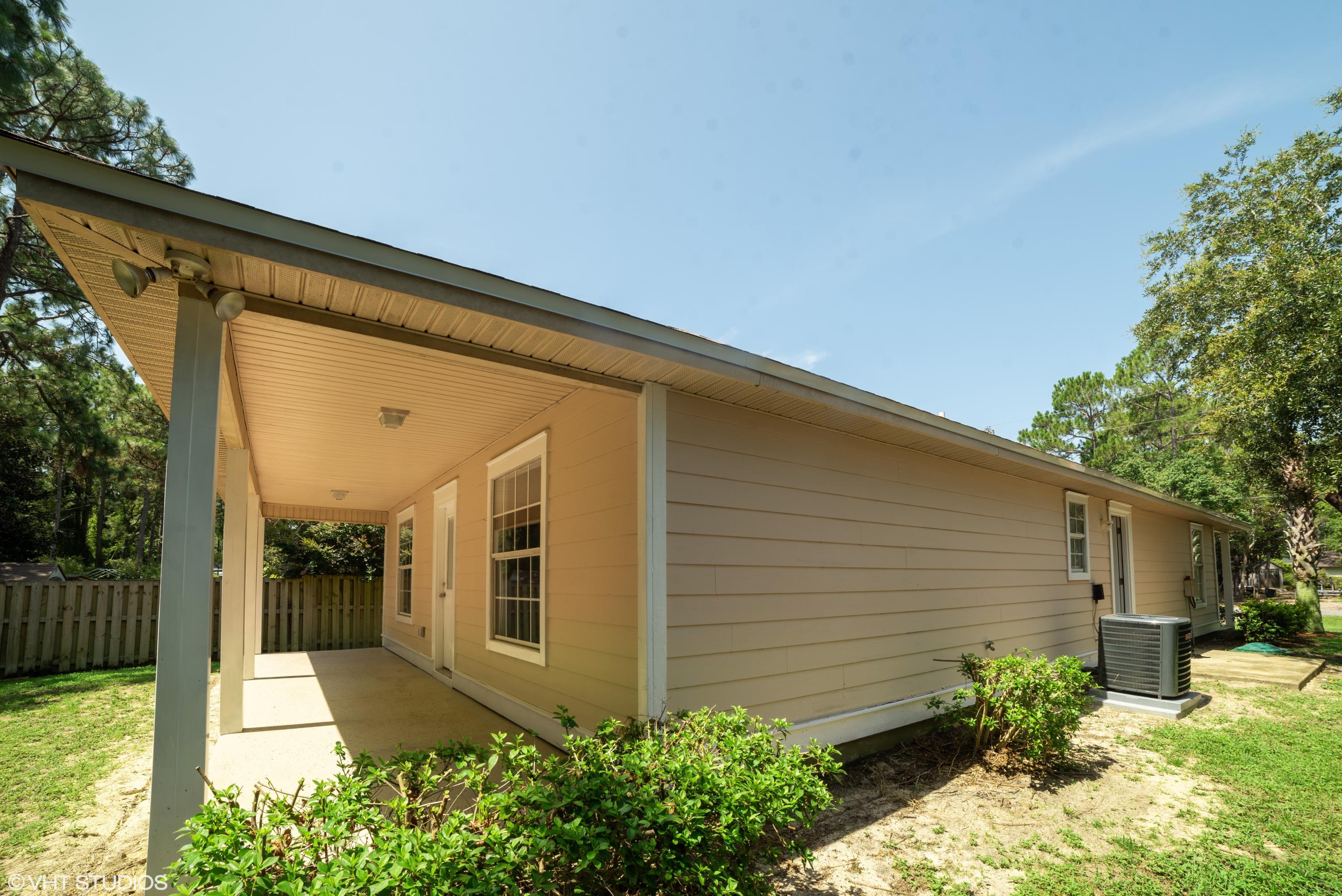92 Central 7th Street Santa Rosa Beach, FL 32459 - Photo 5 of 25 a front view of a house with a yard