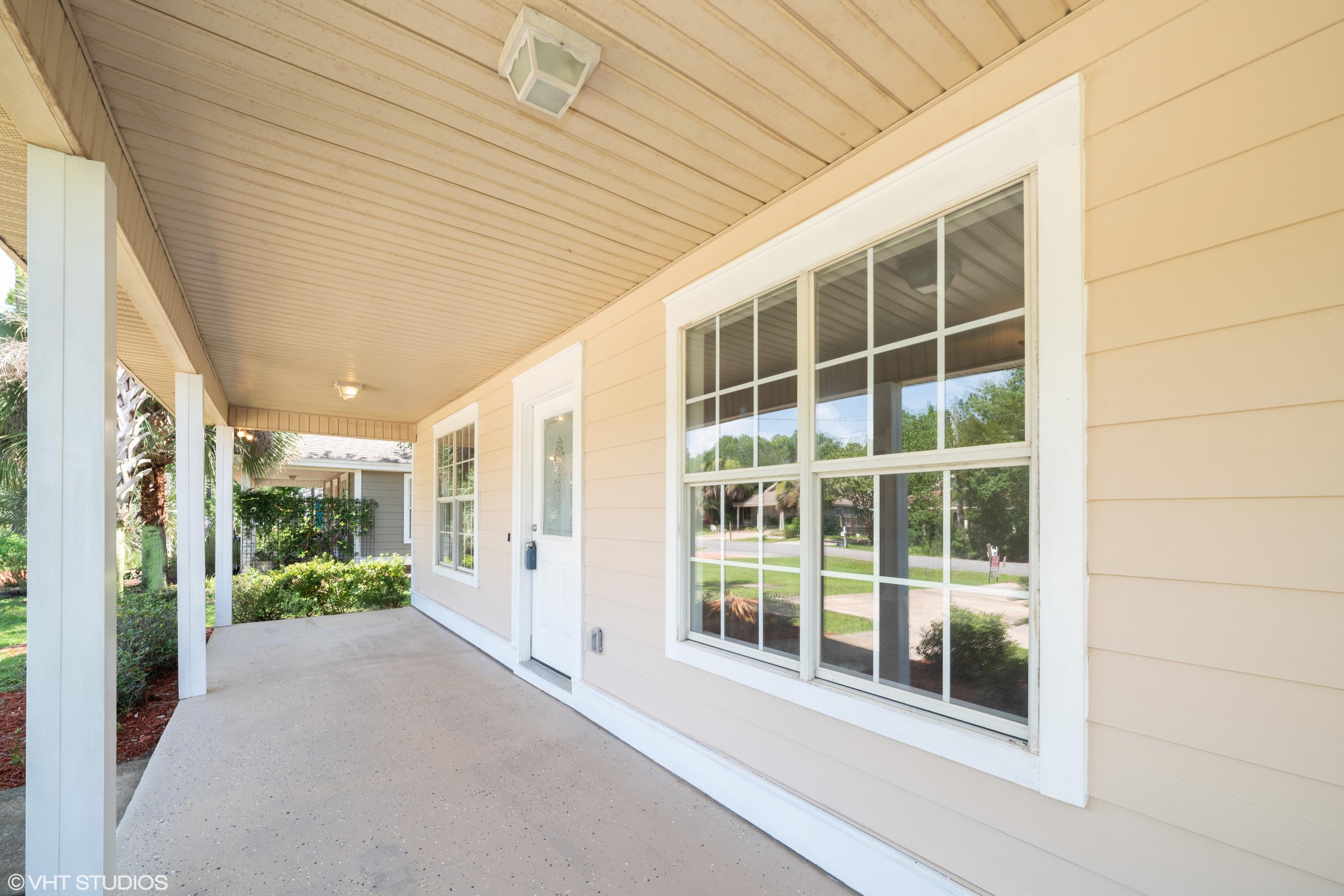 92 Central 7th Street Santa Rosa Beach, FL 32459 - Photo 6 of 25 a view of a porch with windows