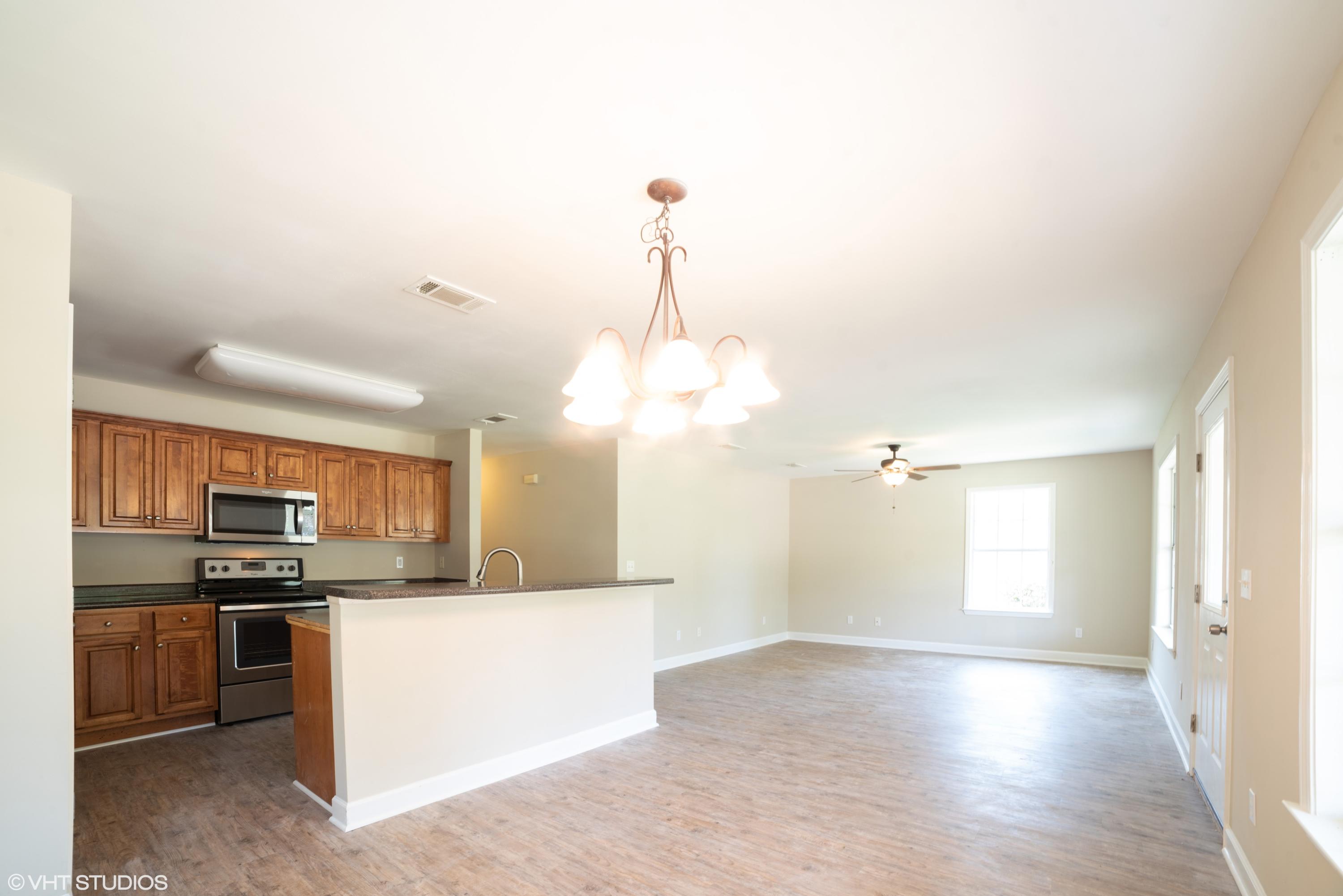 92 Central 7th Street Santa Rosa Beach, FL 32459 - Photo 9 of 25 a view of a kitchen with a sink stainless steel appliances and cabinets
